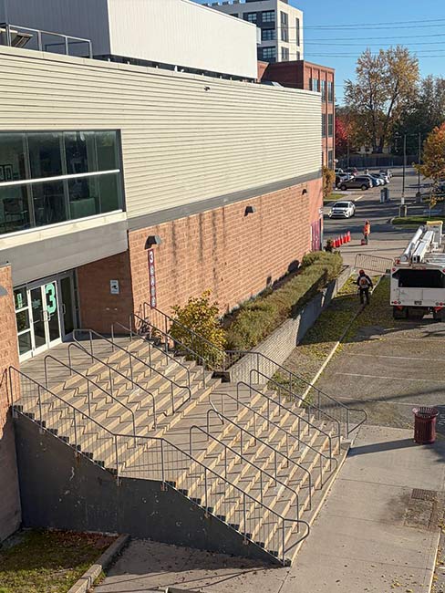 Stairs, paved access and landscaping beside the area of tree removal at the Oshawa arena